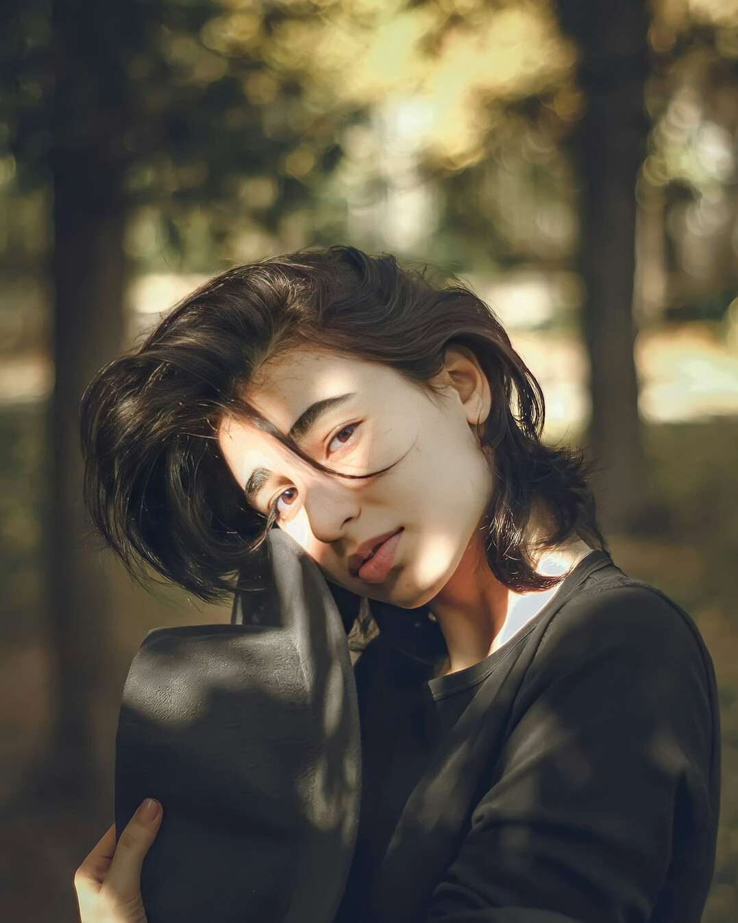 Portrait of a young woman with a notebook and short brown hair