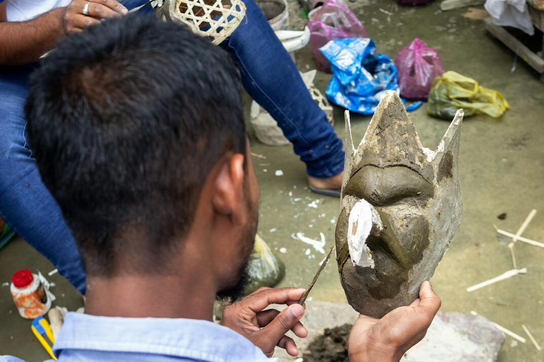researcher studying ancient artifact